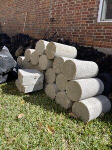 PILINGS - to hold your homes new + correct position.
